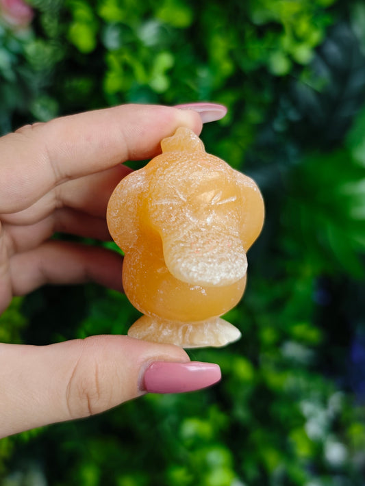 Orange Calcite Psyduck Carving